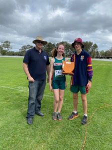 Eliana and Mika receiving the Border District trophy from Mr Brett Pollard Principal of St Mary’s Goondiwindi (guest presenter)
